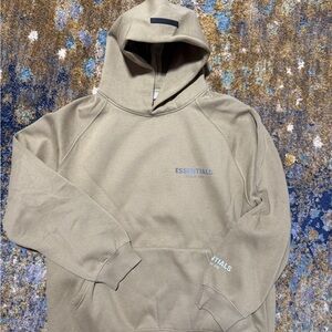Fear of God Essentials Tan Hoodie reflective